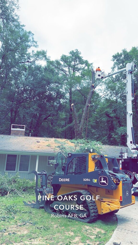 Stump grinder positioned in front of home in Butler, GA